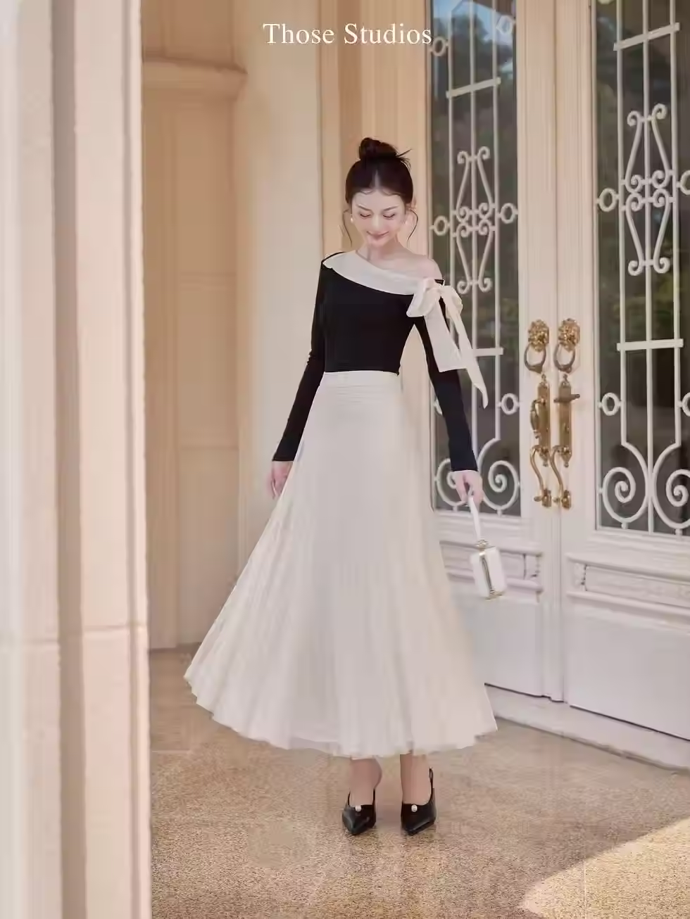 Off-shoulder top and soft tulle flared skirt from Those Studios, perfect for weddings, dates, and city strolls.