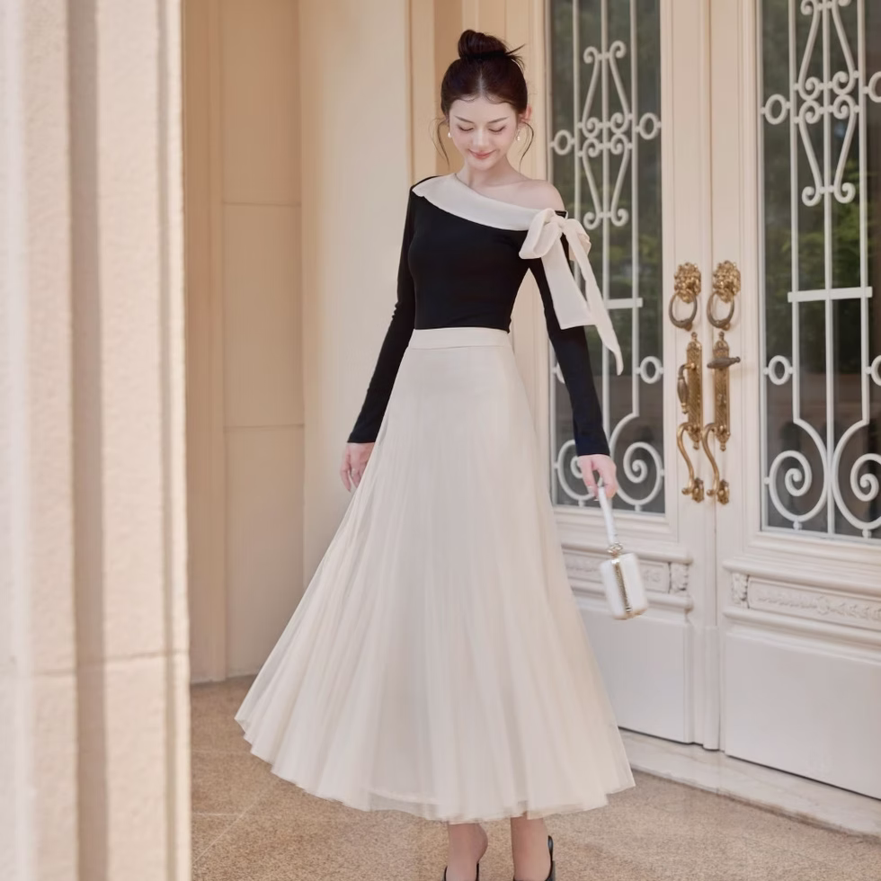 Off-shoulder top and soft tulle flared skirt from Those Studios, perfect for weddings, dates, and city strolls.