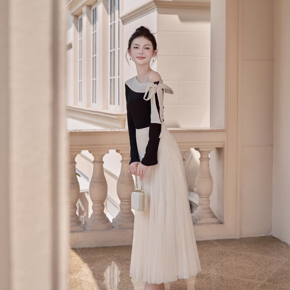 Off-shoulder top and soft tulle flared skirt from Those Studios, perfect for weddings, dates, and city strolls.