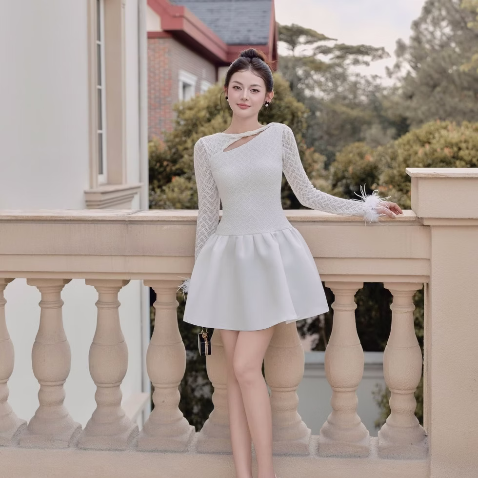 Elegant white Dandelion Dress with lace sleeves and feather cuffs, perfect for stylish evening wear and special occasions.
