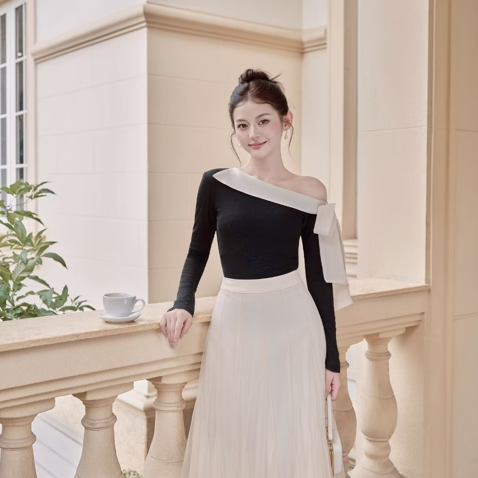 Off-shoulder top and soft tulle flared skirt from Those Studios, perfect for weddings, dates, and city strolls.