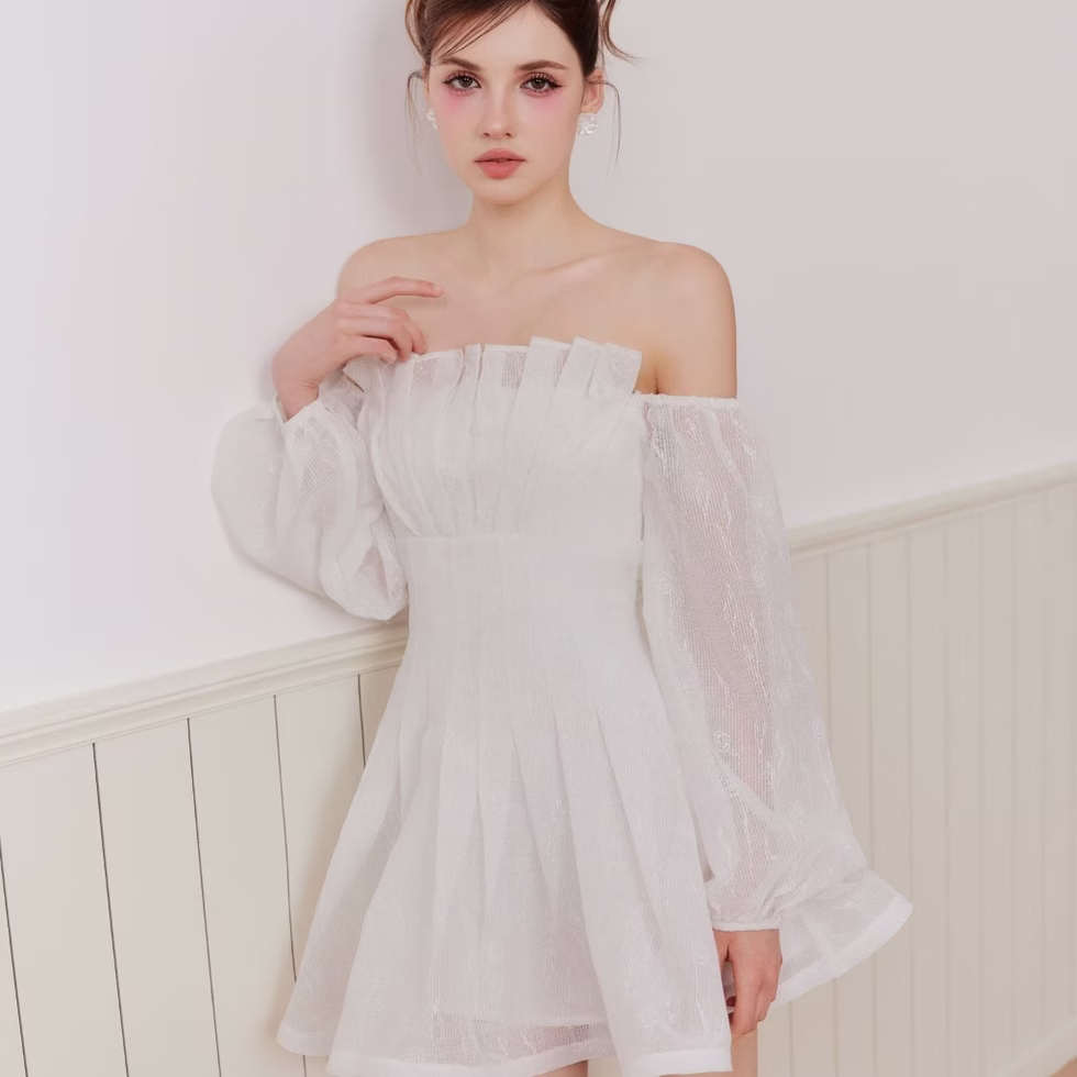 White off-shoulder flare dress with soft silhouette, flattering fit – modern romantic style by Those Studios.