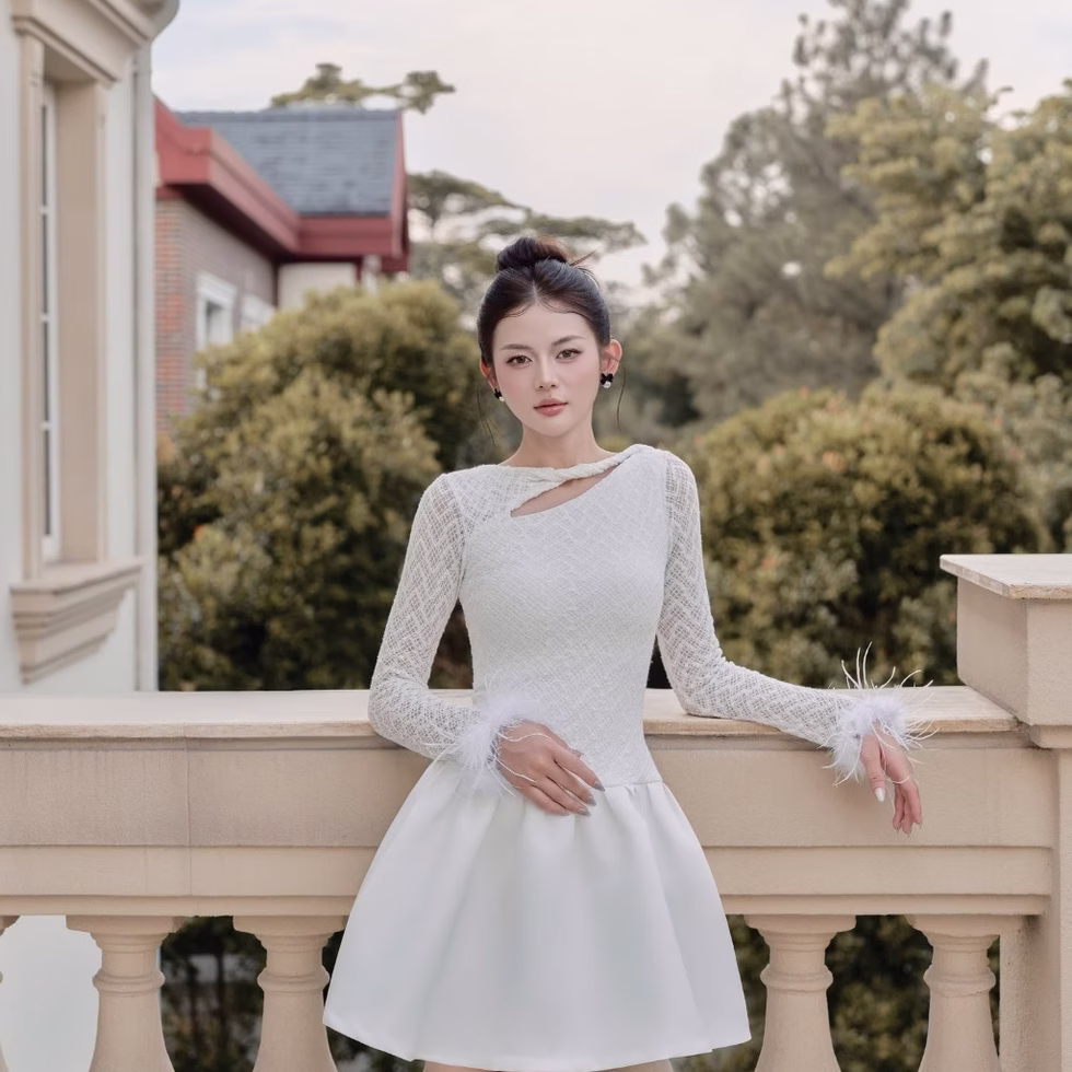 Elegant white Dandelion Dress with lace sleeves and feather cuffs, perfect for stylish evening wear and special occasions.