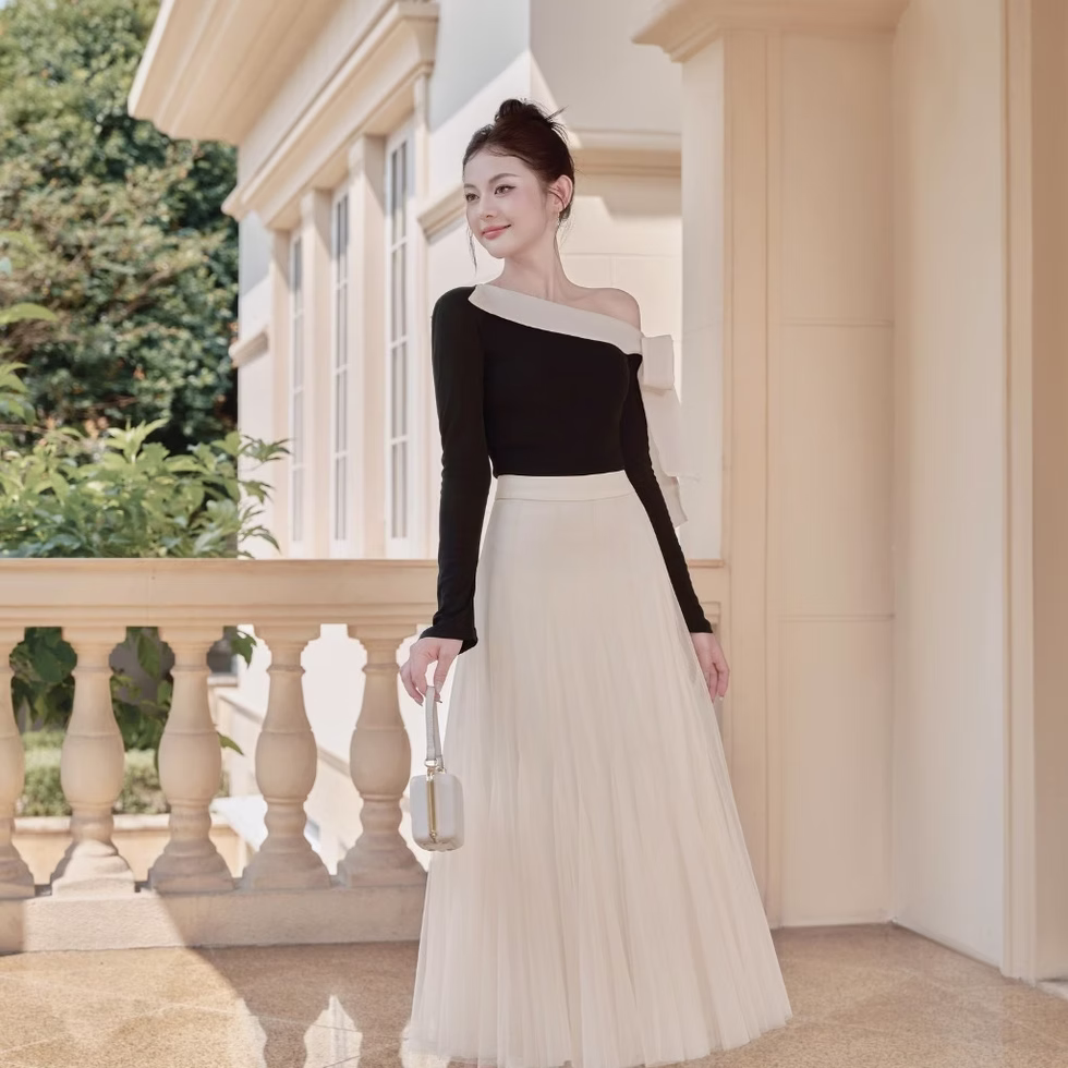 Off-shoulder top and soft tulle flared skirt from Those Studios, perfect for weddings, dates, and city strolls.
