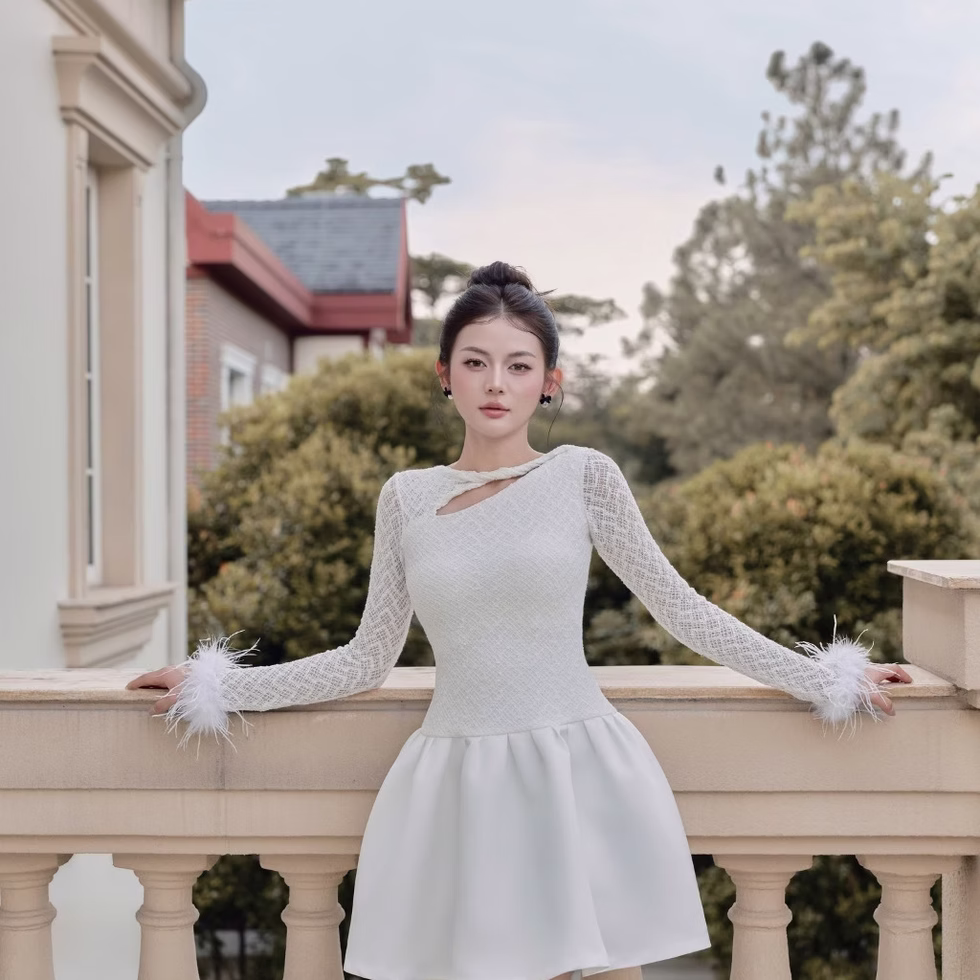 Elegant white Dandelion Dress with lace sleeves and feather cuffs, perfect for stylish evening wear and special occasions.