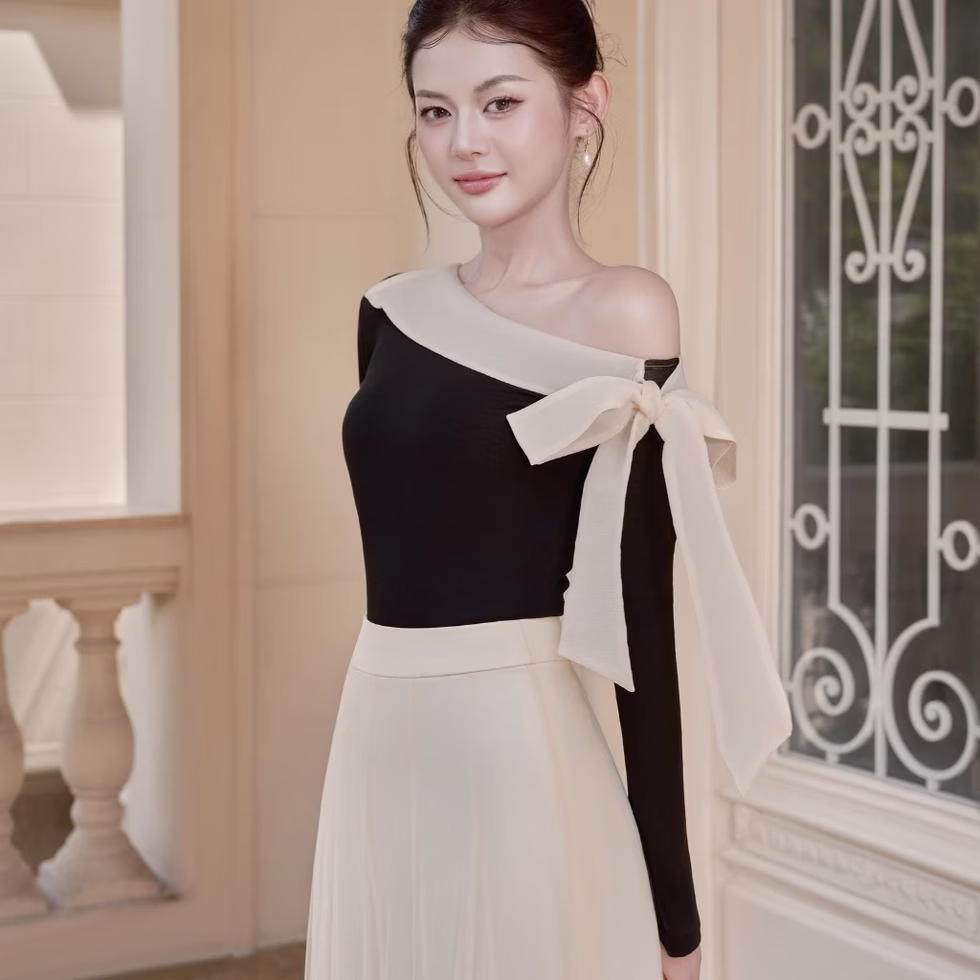 Off-shoulder top and soft tulle flared skirt from Those Studios, perfect for weddings, dates, and city strolls.