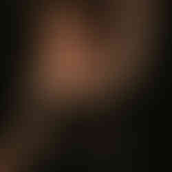 Laying down portrait of woman during boudoir photoshoot at private studio in Bradford County PA.