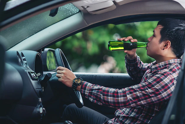 asian-man-drinks-beer-bottle-while-is-driving-car_1150-18643.png