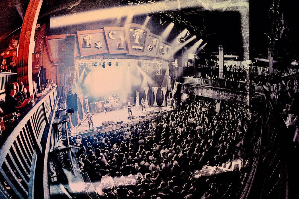 Full venue and stage at a With Arms Wide Open concert
