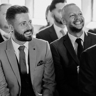 Meg Senior Celebrant | A gay couple laughing at their best friend's wedding ceremony