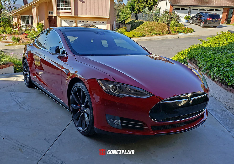 Red 2016 Tesla Model S P90DL with Ludicrous Mode. New custom carbon fiber skirts: Front.
