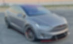 Tesla Model X with custom side skirts and splitter. Photo courtesy of Family Customs.