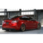 Custom carbon fiber style 3 piece side skirts for Tesla Model S or cars with similar rocker panel lengths. Side skirts with a fin near the back. Shown installed on a Tesla Model 3.