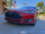 Red 2016 Tesla Model S P90DL with Ludicrous Mode. New custom carbon fiber skirts: Front.