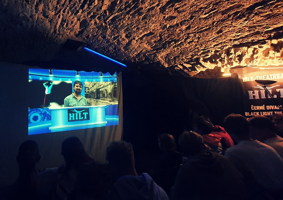 Visitors waiting for the show start at HILT back light theatre Prague in 15th century space