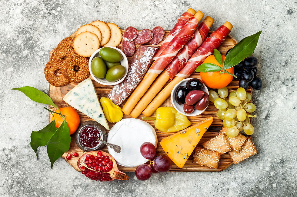 Eye-level view of a luxury charcuterie board with assorted meats and cheeses