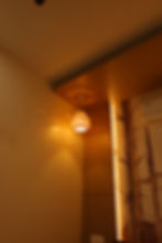 Decorative hanging lamp with patterned light on wall