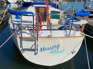 Rear view of S/V Messing About in slip