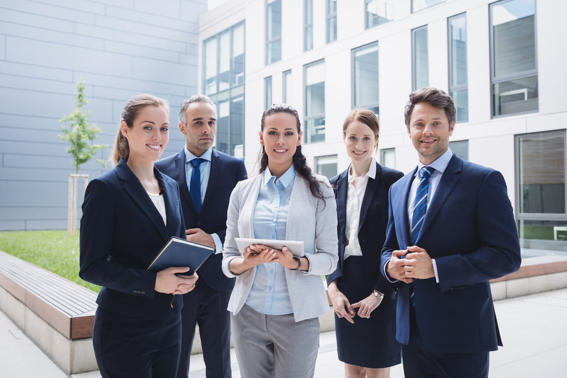businesspeople-standing-outside-office-building.jpeg