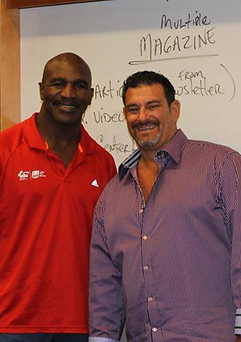 Marc with Evander Holyfield, an American professional boxer who remains the only boxer in history to win the undisputed championship in two weight classes.