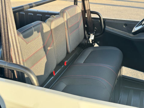 Interior seating of 2025 KANDI Innovator e10K Gray electric UTV with seatbelts at Corona Powersports.