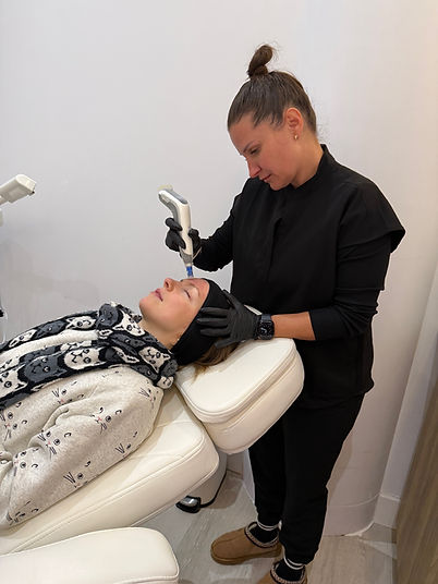 Registered Nurse and Founder of Prestige Medical Aesthetics, Sandra Wilczynska, is doing a Microneedling treatment on her client with the Dermapen 4 at her Georgina location.