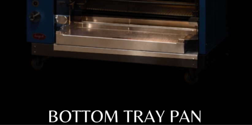 Eye-level view of stainless steel rotisserie bottom tray filled with water and grease mixture