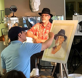 NC Artist JJ Jiang doing watercolor portrait painting at the Village Art Circle Studio & Gallery in Cary, NC