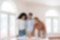 front-view-of-female-realtor-showing-new-house-plan-to-couple.jpg