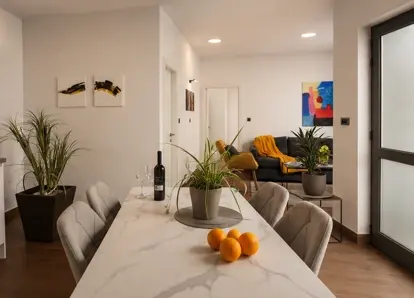Dining area with table and chairs in Terra 5 Deluxe apartment, Rijeka