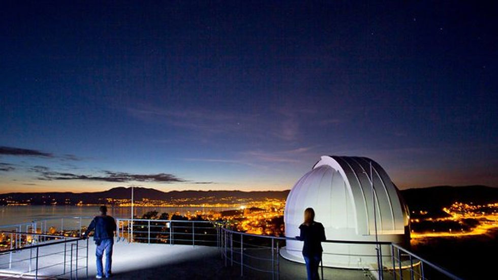 Eye-level view of the Astronomical Center Rijeka observatory dome under a clear night sky