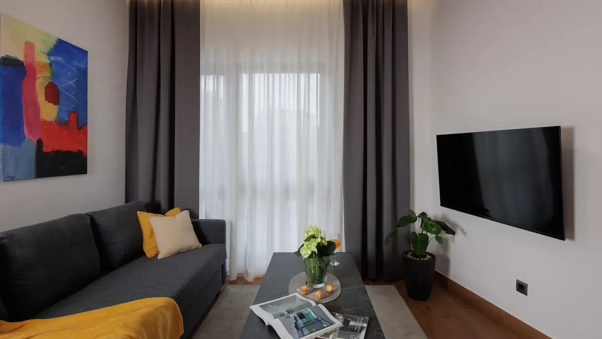Living room from another angle showing smart TV and coffee table