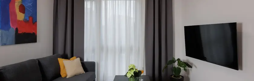 Living room from another angle showing smart TV and tea table
