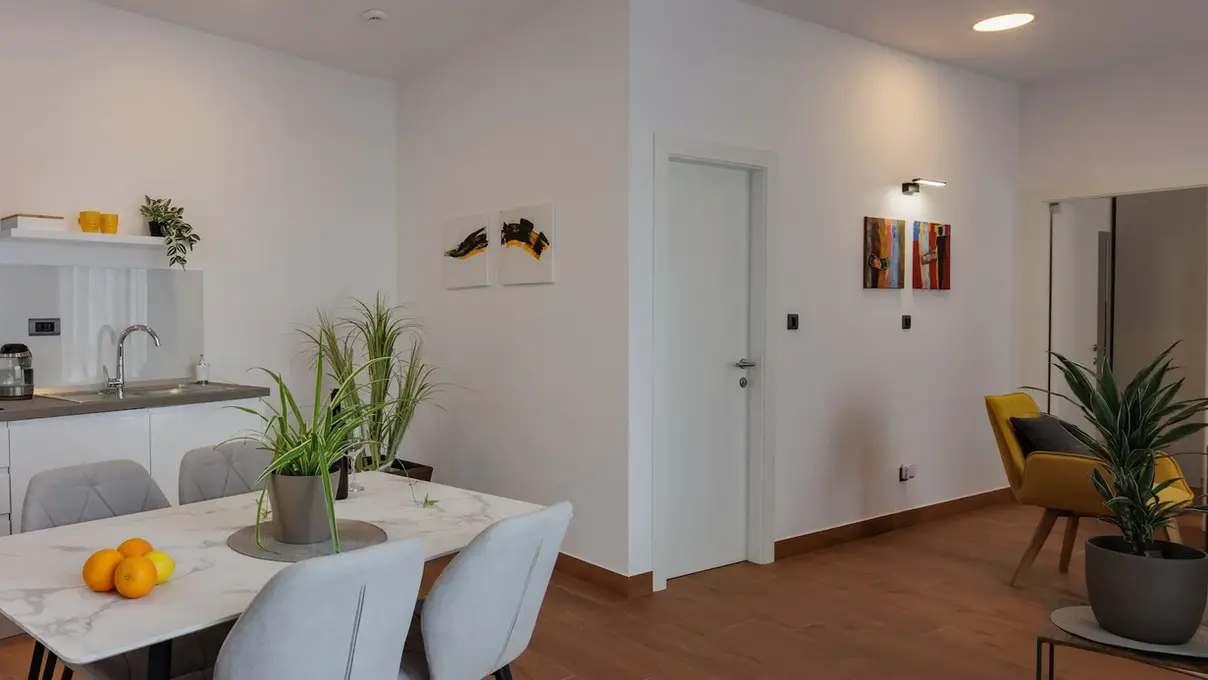 Dining area with table and chairs in Terra 5 Deluxe apartment, Rijeka