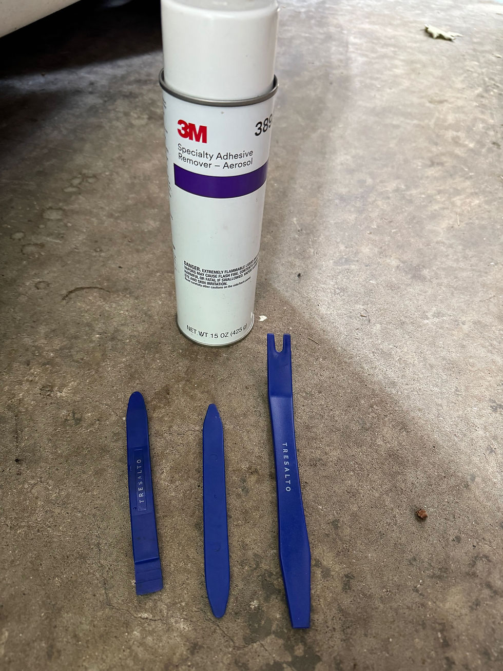 plastic scrapers, a toothbrush, some rags and 3M adhesive remove got the old junk off. 