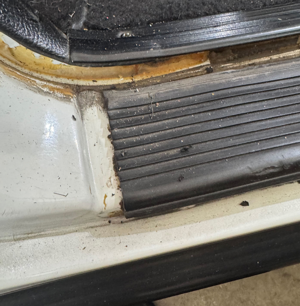 The sill plate is obviously too short - it should go all the way to the seam, and it appears to have been crudely cut.