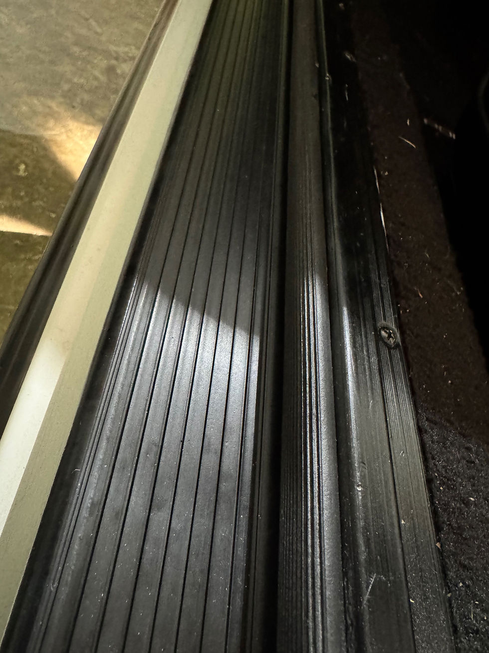 If you can, install the new sill plate first.  They need to mount flush against the sill, and their adhesive strips are very sticky.  You can see the ribs in the seal here as well. 