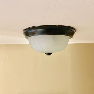 Ceiling light fixture that is off from the side.