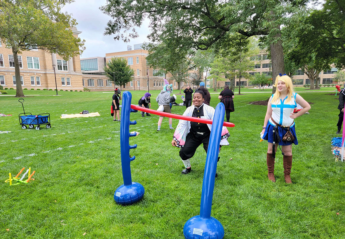 A person going under a limbo 