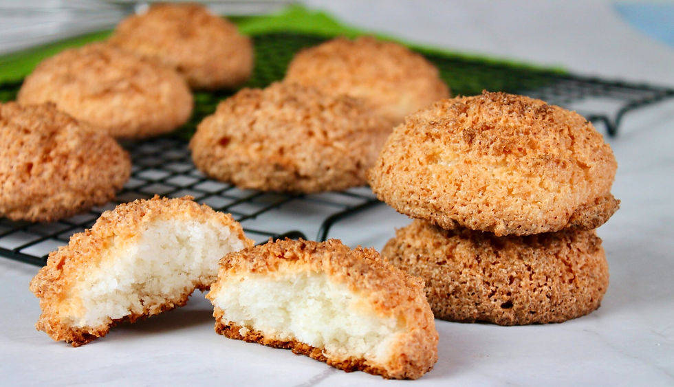 Coconut macaroons on a cooling rack, deliciously golden and perfectly baked coconut biscuits.