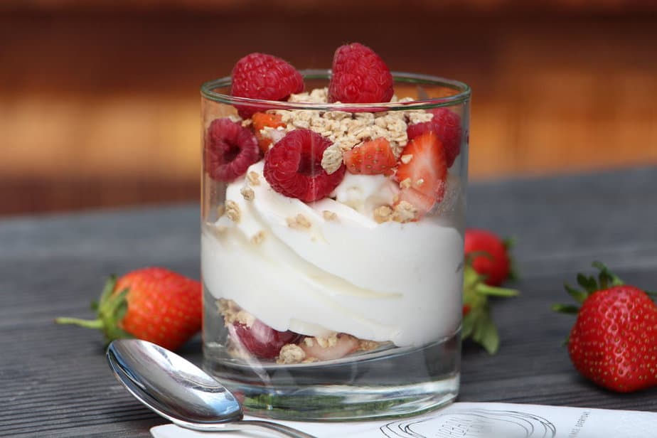 Yogurt with berries and granola: A delicious and refreshing dessert made with fermented milk, sugar, and flavorful ingredients like vanilla or cardamom. Enjoyed as a cooling treat on warm Kenyan days.