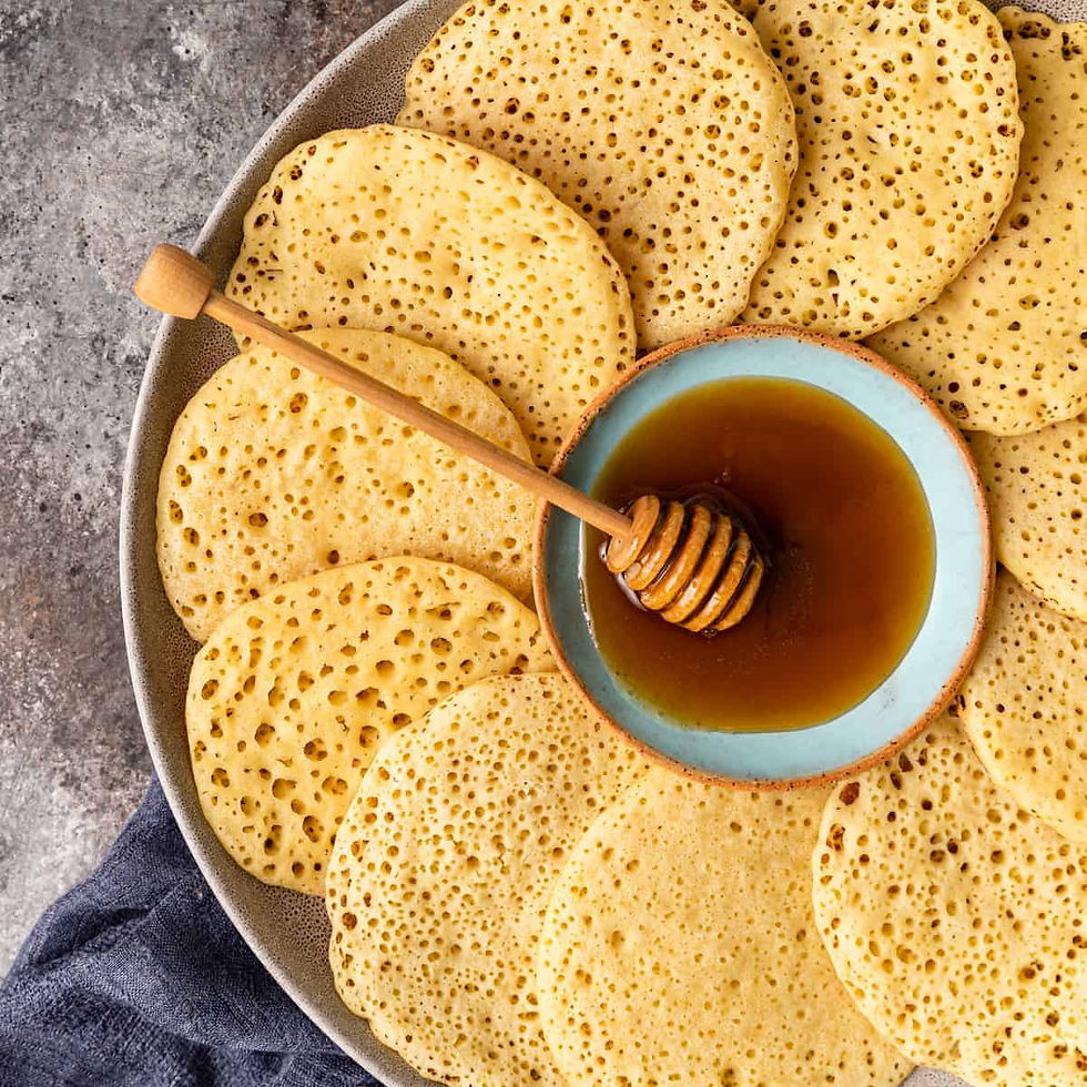 homemade Beghrir drizzled with honey