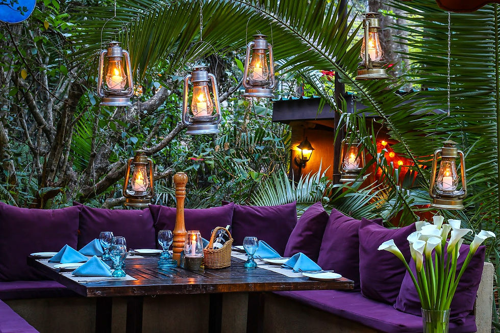 A stylish table with purple cushions and lamps, creating an elegant atmosphere at About Thyme, a hidden gem in Nairobi's lush suburbs.
