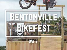 A photo of a bicyclist in the air with the words 'Bentonville Bikefest' in a recatangle below it. The words 'day 2' are below that.