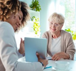 caregiver giving information on houston home health care services