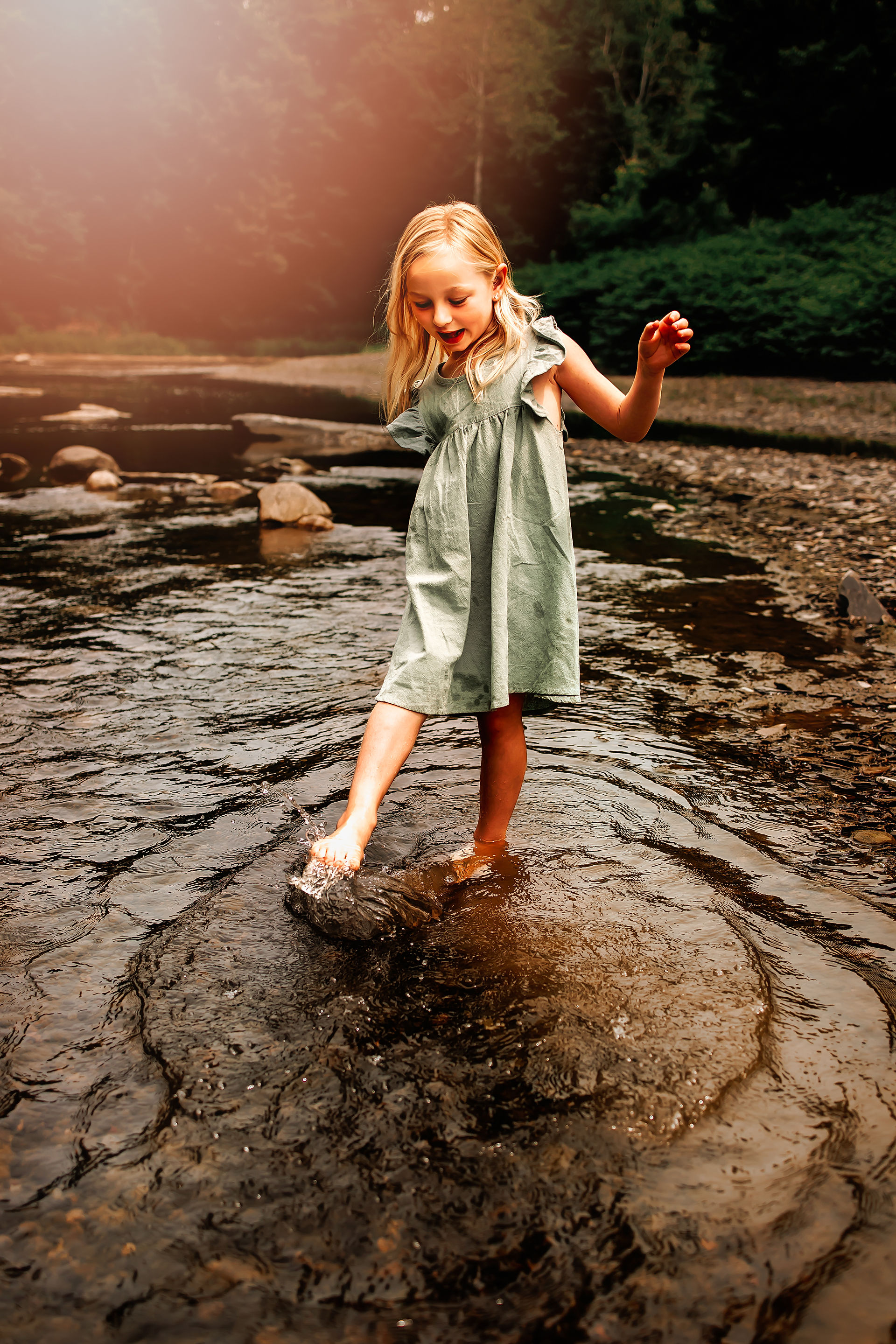 Child standing in creek during family photo session at Hobuck Flats near Buffalo NY with Kimberly A. Muth Photography