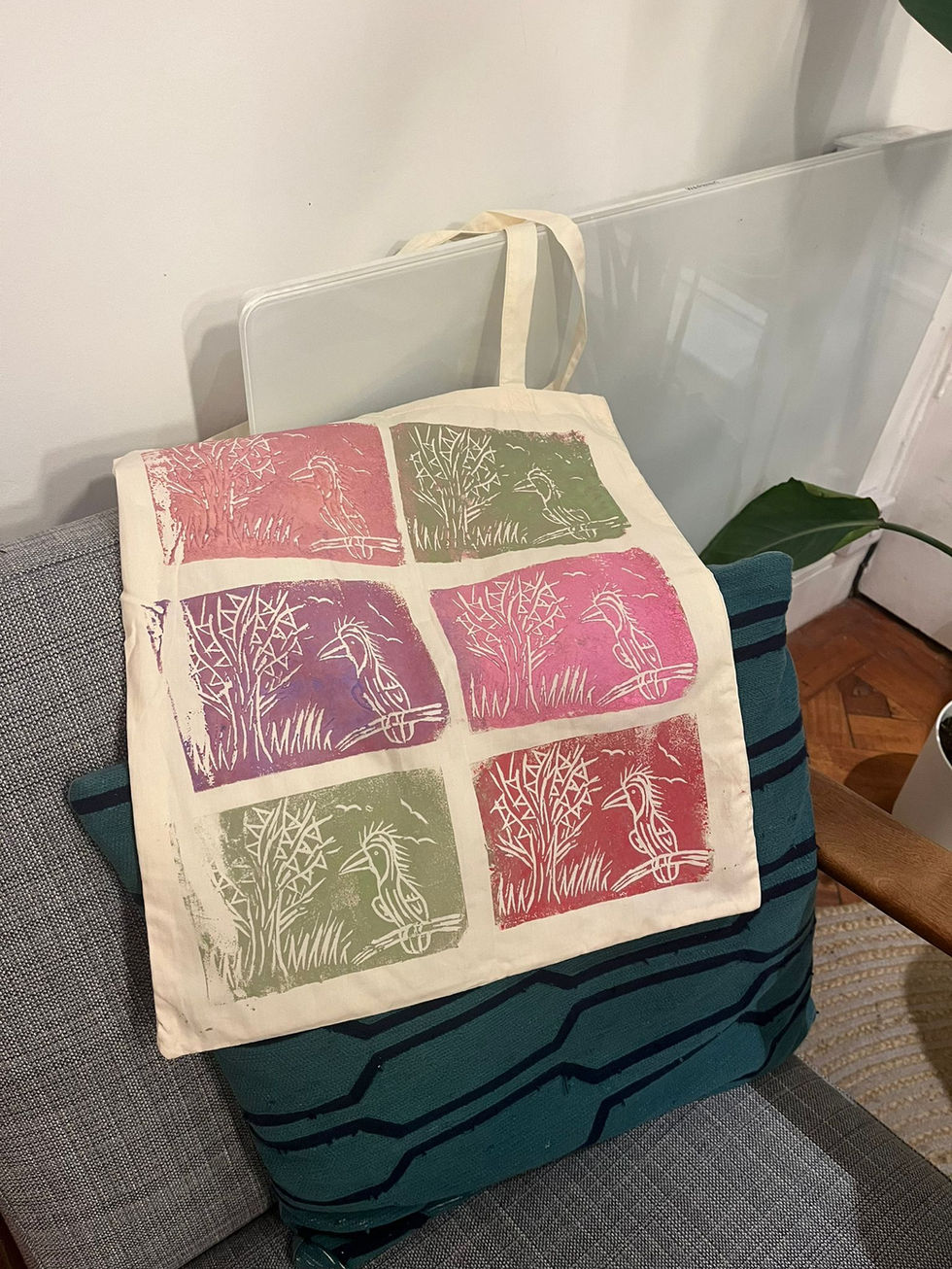 lino print of a bird and trees