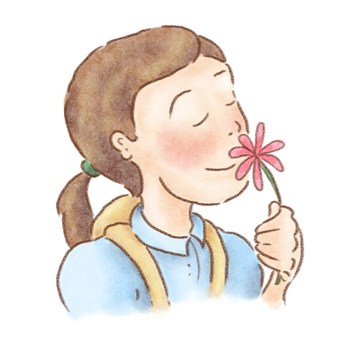 Clara smelling a flower