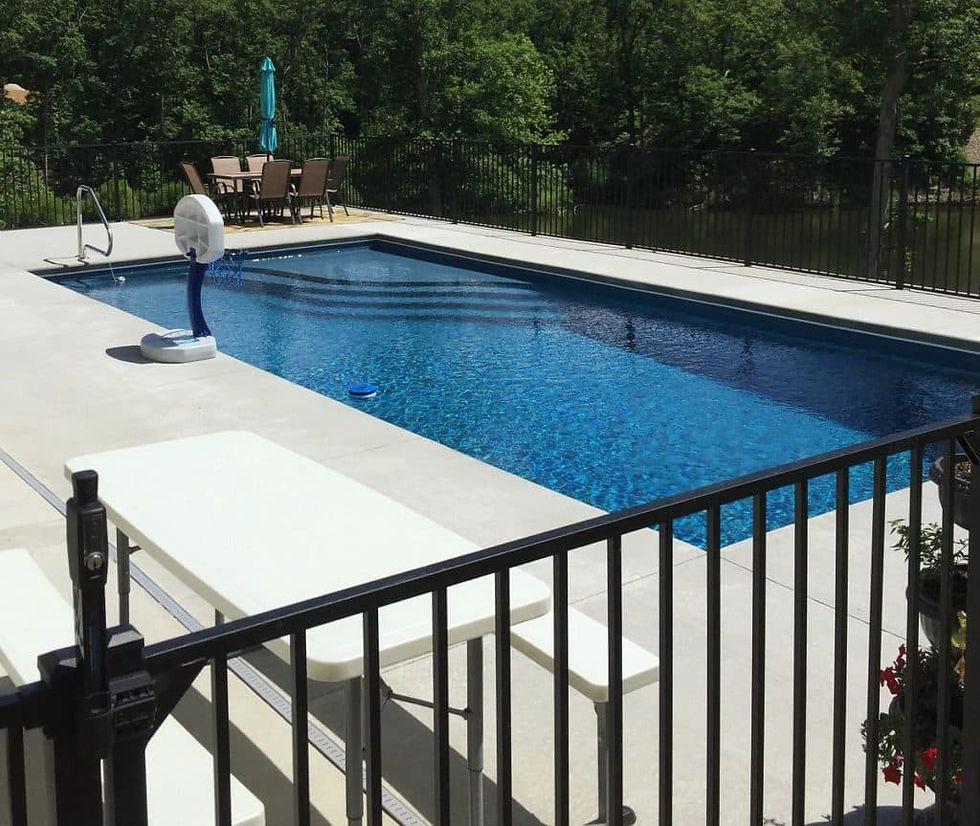 Finished fiberglass swimming pool after installation and decking completion