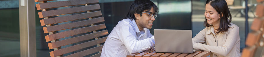 two-students-looking-at-laptop.jpg